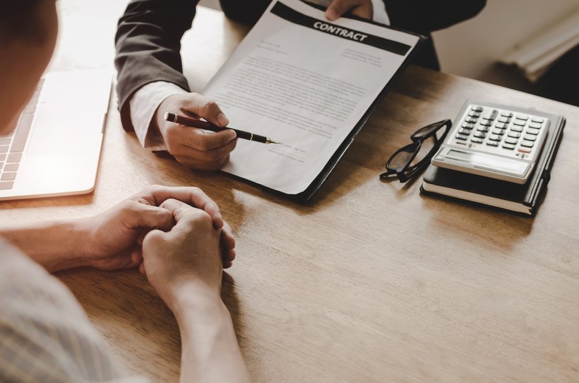 Attorney reviewing a contract with a client